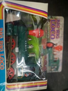 Rig Loco" battery-operated toy train. 

Type: Collectible toy steam engine.

Fea